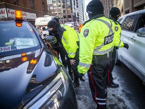 Ottawa bylaw officers, supported by police, have handed out some tickets in the protest 'red zone.'