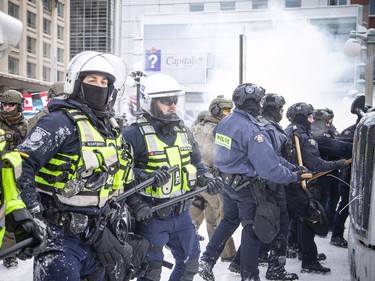 Police from all different forces across the country joined together to try to bring the "Freedom Convoy" occupation to an end Saturday, February 19, 2022. Police used paper spray and stun grenades as they moved west on Wellington Street Saturday.