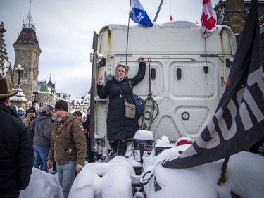 Police from all different forces across the country joined together to try to bring the "Freedom Convoy" occupation to an end Saturday, February 19, 2022. A woman stood on the back of her truck as police moved into the area the protesters were occupying on Wellington Street.