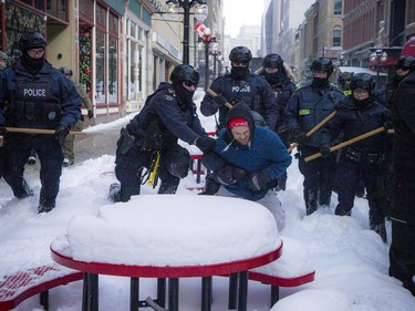 Police from all different forces across the country joined together to try to bring the "Freedom Convoy" occupation to an end Saturday, February 19, 2022. A protester was detained on Sparks Street Saturday afternoon.