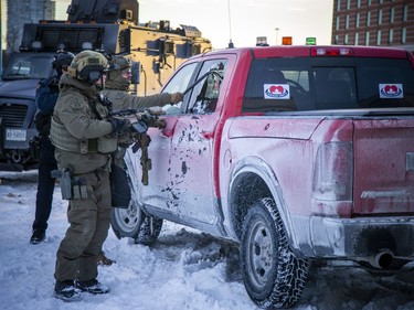 Police from multiple forces moved in to clear out the remaining "Freedom Convoy" protesters that were set up in a parking lot on Coventry Road, Sunday. Members of the RCMP broke a window of a red pickup truck that had locked doors to prevent a search of the vehicle.