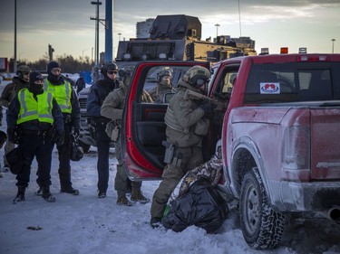 Police from multiple forces moved in to clear out the remaining "Freedom Convoy" protesters that were set up in a parking lot on Coventry Road, Sunday. Members of the RCMP broke a window of a red pickup truck that had locked doors to prevent a search of the vehicle.