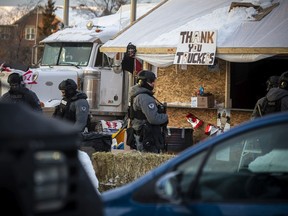 Police from multiple forces moved in to clear out the remaining "Freedom Convoy"  protesters that were set up in a parking lot on Coventry Road, Sunday, Feb. 20, 2022.