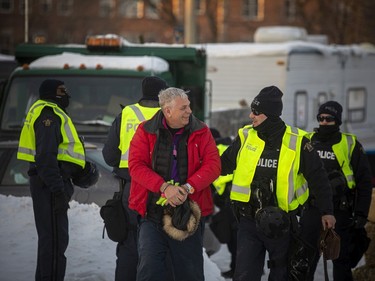 Police from multiple forces moved in to clear out the remaining "Freedom Convoy"  protesters that were set up in a parking lot on Coventry Road, Sunday, Feb. 20, 2022. Two protesters were observed being arrested and taken into police custody Sunday evening.