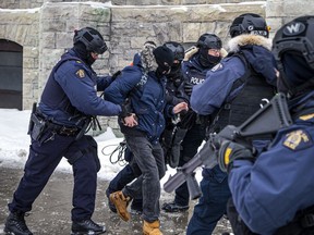 A person tried to run from police but was quickly apprehended and taken into custody Sunday afternoon during a crackdown on the truck convoy protesters.
