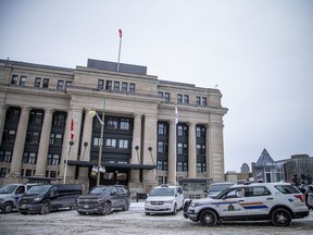 Vehicles in front of the Government Conference Centre on Rideau Street, Sunday, Feb. 20, 2022.