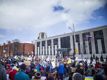 A large group of people gathered outside the Russian Embassy in Sandy Hill, to stand united with Ukrainians and protest the Russia invasion of Ukraine, Sunday, Feb. 27, 2022.