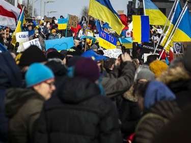 A large group of people gathered outside the Russian Embassy in Sandy Hill, to stand united with Ukrainians and protest the Russia invasion of Ukraine, Sunday, Feb. 27, 2022. The protest started on Charlotte Street and the supporters then marched down Laurier, ending at City Hall.