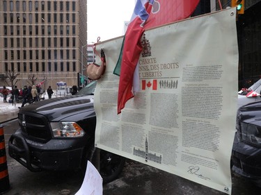 The trucker protest entered its 12th day in the capital Tuesday, a day after a judge granted an injunction against honking in downtown Ottawa. The Charter of Rights poster downtown Ottawa on February 08, 2022.