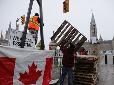 The trucker protest entered its 12th day in the capital Tuesday, a day after a judge granted an injunction against honking in downtown Ottawa.
