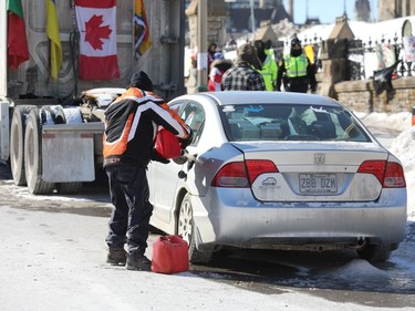 Refueling at the 'Freedom Convoy' on Wellington street in Ottawa, Feb. 14, 2022.