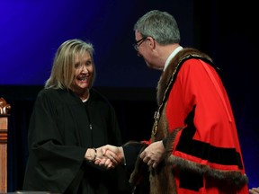 Happier times: Diane Deans is sworn in as councillor for Ward 10 Gloucester-Southgate and congratulated by Ottawa Mayor Jim Watson in December, 2018.