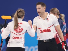 John Morris and Rachel Homan of Team Canada celebrate victory against Team United States during the Curling Mixed Doubles Round Robin on Day 1 of the Beijing 2022 Winter Olympics at National Aquatics Centre on February 05, 2022 in Beijing, China.