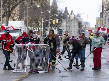Anti-vaccine mandate protests continue in downtown Ottawa. Protestors held an east vs west street hockey game with a version of the Stanley Cup made out of a garbage can and a bucket. Tuesday, Feb. 1, 2022.
