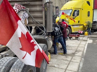 Anti-vaccine mandate protests continue in downtown Ottawa on Friday, Feb. 11, 2022.Refuelling their trucks at Rideau Street and Sussex Drive.