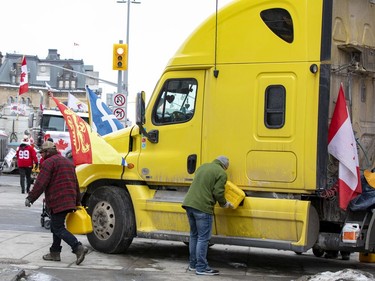 Anti-vaccine mandate protests continue in downtown Ottawa on Friday, Feb. 11, 2022. Refuelling their trucks at Rideau Street and Sussex Drive.