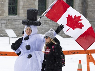 Anti-vaccine mandate protests continue in downtown Ottawa on Saturday, Feb. 12, 2022.