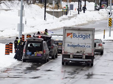 OTTAWA -- A police checkpoint on Elgin Street following the dispersal of anti mandate protesters that occupied the nation's capital for over three weeks. Monday, Feb. 21, 2022