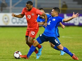 El Salvador's midfielder Narciso Orellana (R) vies for the ball with Canada's forward Junior Hoilett (L) during the FIFA World Cup Concacaf qualifier football match between El Salvador and Canada at Cuscatlan Stadium in San Salvador on February 2, 2022.