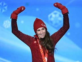 Silver medallist Canada's Ivanie Blondin poses on the podium during the women's speed skating mass start victory ceremony of the Beijing Games. Getty Images
