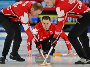 Canada's Brad Gushue reacts during the mens round robin session 5 game of the Beijing 2022 Winter Olympic Games curling competition between Canada and Sweden, at the National Aquatics Centre.