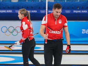 John Morris and Rachel Homan react to losing to Italy in mixed curling at the Beijing 2022 Winter Olympics on Monday, February 7, 2022. The defeat ended the team’s chance for a medal.