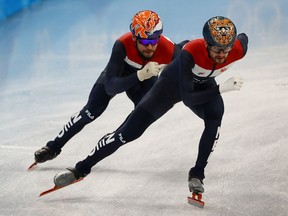 Dutch's Sjinkie Knegt and Itzhak de Laat practice short track speed skating during a training session at the Capital Indoor Stadium ahead of the Beijing 2022 Winter Olympics in Beijing, China January 31, 2022