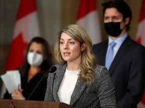 Foreign Affairs minister Melanie Joly speaks at a news conference about the situation in Ukraine, with Prime Minister Justin Trudeau and Deputy Prime Minister Chrystia Freeland in Ottawa.