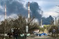 Smoke rises from a power plant after shelling outside the town of Schastia, near the eastern Ukraine city of Lugansk, on February 22, 2022. (Photo by ARIS MESSINIS/AFP via Getty Images)