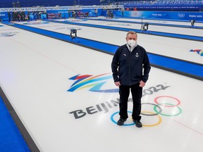 Hans Wuthrich, chief ice technician for the curling events at the Beijing 2022 Winter Olympics, stands on one of the sheets at the Ice Cube venue in Beijing on Tuesday, February 1, 2022.
