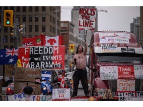 A demonstrator makes his point in downtown Ottawa Wednesday.