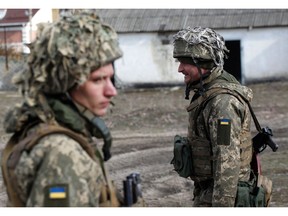 Ukrainian servicemen are seen at a position on the front line with Russia-backed separatists outside the town of Schastia, near the eastern Ukraine city of Lugansk, on Feb. 23.