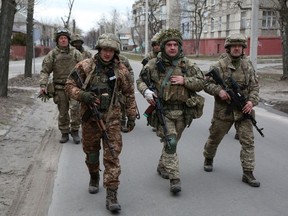 Members of the Ukrainian Military Forces patrol in the small town of Sievierodonetsk, Lugansk Oblast, on the weekend.