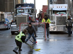 Protesters and supporters play street hockey downtown Feb. 7.