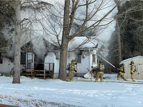 Firefighters responded to a fire in a home fully engulfed in smoke and flames Tuesday, Feb. 15, 2022.