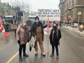 Elizabeth Hay and two counter-protesters who asked not to be named.