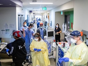 File photo/ Nurses, doctors, and respiratory therapist prepare to intubate a  COVID-19 patient as the Omicron coronavirus variant continues to put pressure on Humber River Hospital in Toronto.