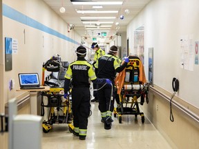 File photo: Toronto paramedics deliver patients to an emergency room.