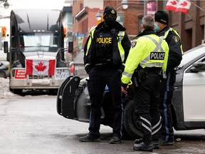 Police block a downtown intersection as truckers and supporters continue to protest COVID-19 vaccine mandates in Ottawa.
