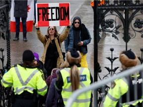A protester yells at people leaving Parliament Hill as truckers and supporters continue to protest in Ottawa this week.