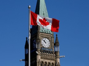 FILE PHOTO: A Canadian flag flies in front of the Peace Tower on Parliament Hill in Ottawa, Ontario, Canada, March 22, 2017.