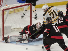 Ottawa Senators goalie Matt Murray (30) makes a save in front of Boston Bruins left wing Taylor Hall (71) in the third period at the Canadian Tire Centre.