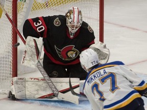 Ottawa Senators goalie Matt Murray (30) makes a save on a shot from St. Louis Blues defenceman Niko Mikkola (77) in the third period at the Canadian Tire Centre, Feb. 15, 2022.