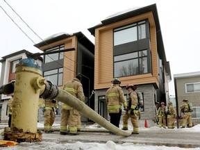 Ottawa firefighters on the scene of a fire on Hinchey Avenue in the Mechanicsville district Wednesday morning.