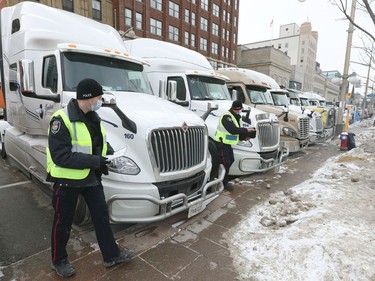 OTTAWA - Feb 16, 2022 - Truckers occupation and protesting continues its 20th day in downtown Ottawa Wednesday morning. Police were handing out notices to downtown demonstrators warning that if they continue to block streets, they are committing a criminal offence and face arrest.