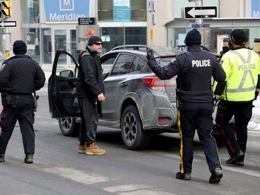 OTTAWA - Feb 16, 2022 - Truckers occupation and protesting continues its 20th day in downtown Ottawa Wednesday morning. Police were handing out notices to downtown demonstrators warning that if they continue to block streets, they are committing a criminal offence and face arrest.