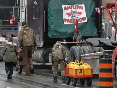 OTTAWA - Feb 2, 2022 - Anti vaccine mandate protesters and truckers protesting their sixth day in downtown Ottawa Wednesday. Volunteers bringing truckers gas on Wellington Street Wednesday.