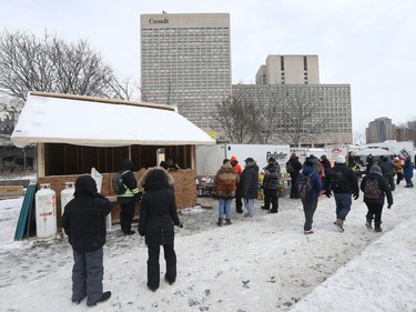 Anti-vaccine mandate protesters and truckers protesting their eighth day in Ottawa Friday.  A building has been built on NCC property near the Rideau Canal.