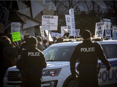 OTTAWA -- Thousands gathered in the downtown core for a protest in connection with the Freedom Convoy that made their way from various locations across Canada and landed in Ottawa, Saturday, Feb. 5, 2022. A counter protest took place on the front lawn of City Hall and Convoy protestors faced off from Confederation Park.