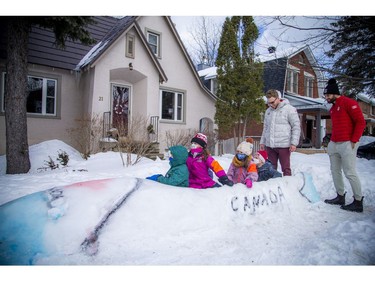 Team Canada bobsleigh members Mike Evelyn, right, and Cody Sorensen returned to Sorensen's family home in Hampton Park to greet some local kids who created a snow bobsled.